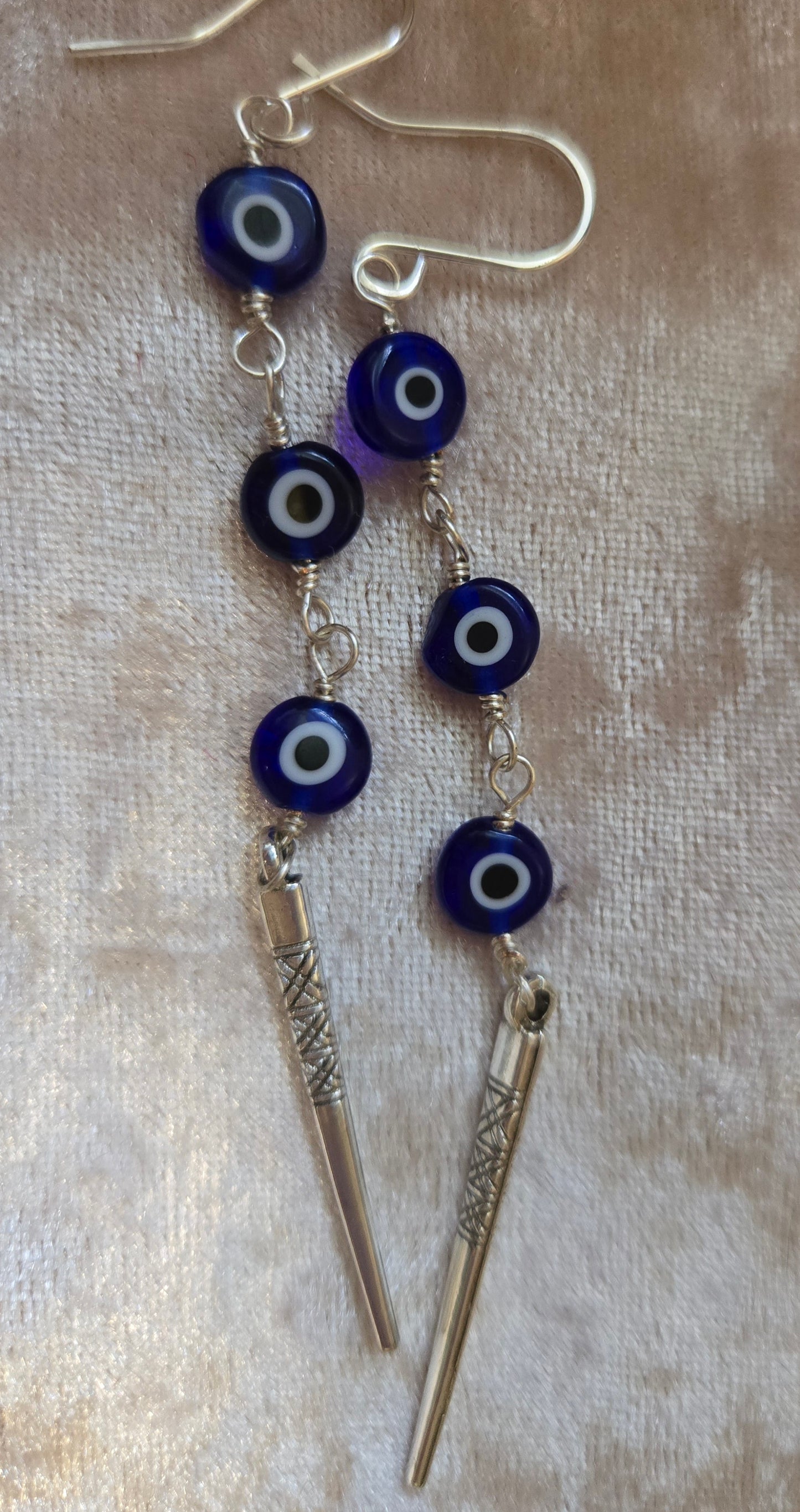 Evil eye dangle earrings